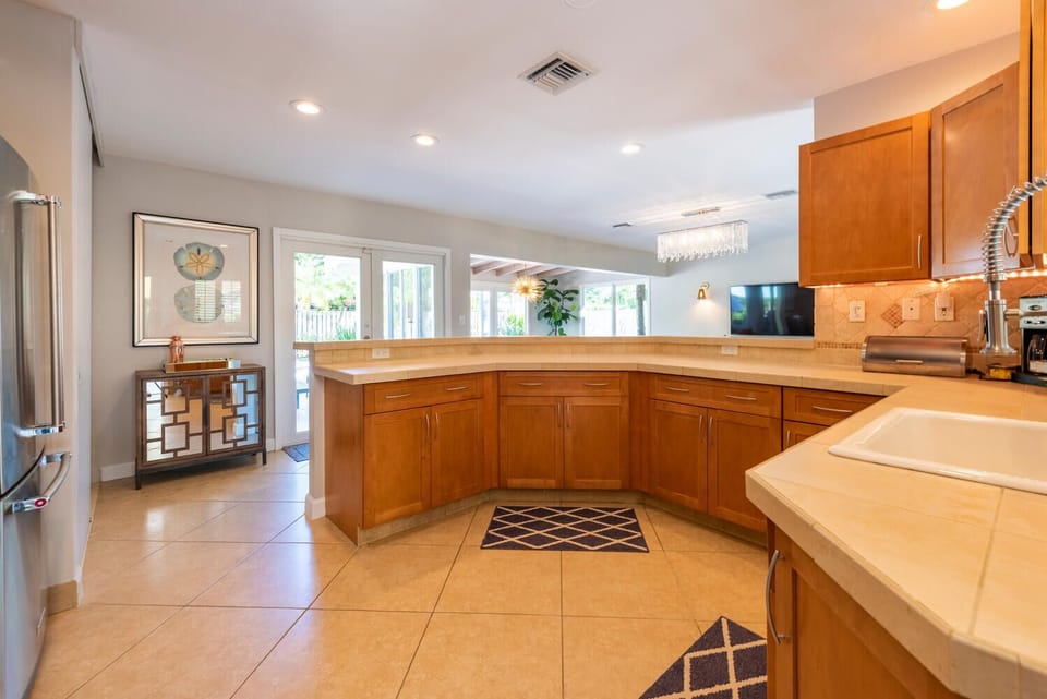 A Chef's dream w/ gas cooking and new KitchenAid appliances. Open plan.