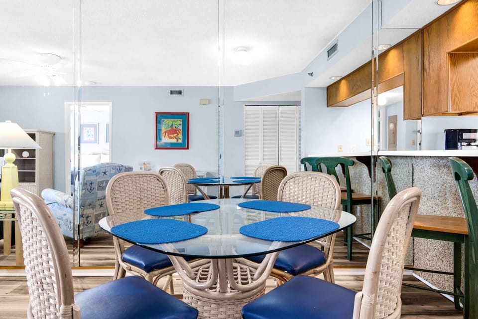 Dining table with seating for four, and seating at the bar