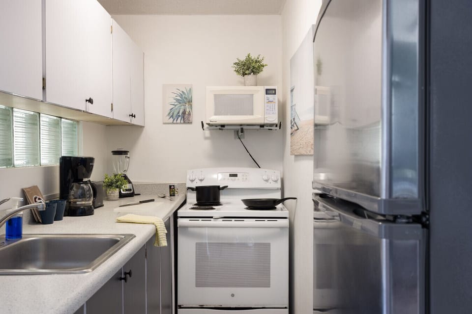Full kitchen with full fridge, stove, coffee maker and more!