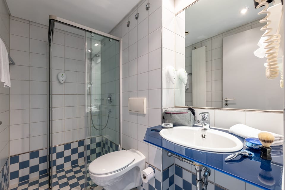Shower, towels, soap, toilet paper