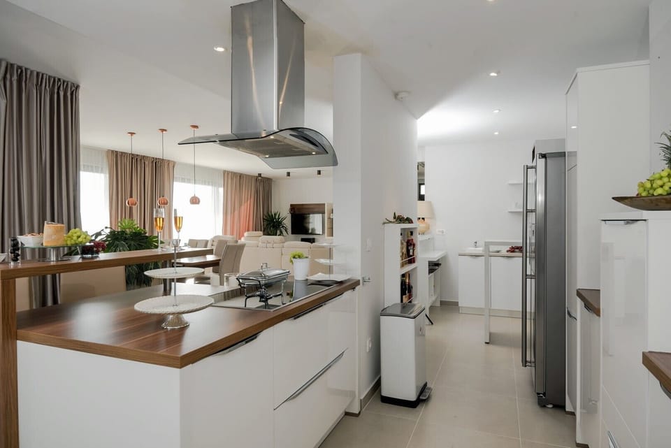 Spacious modern kitchen on the ground floor of the luxury villa Happiness with pool in Omiš
