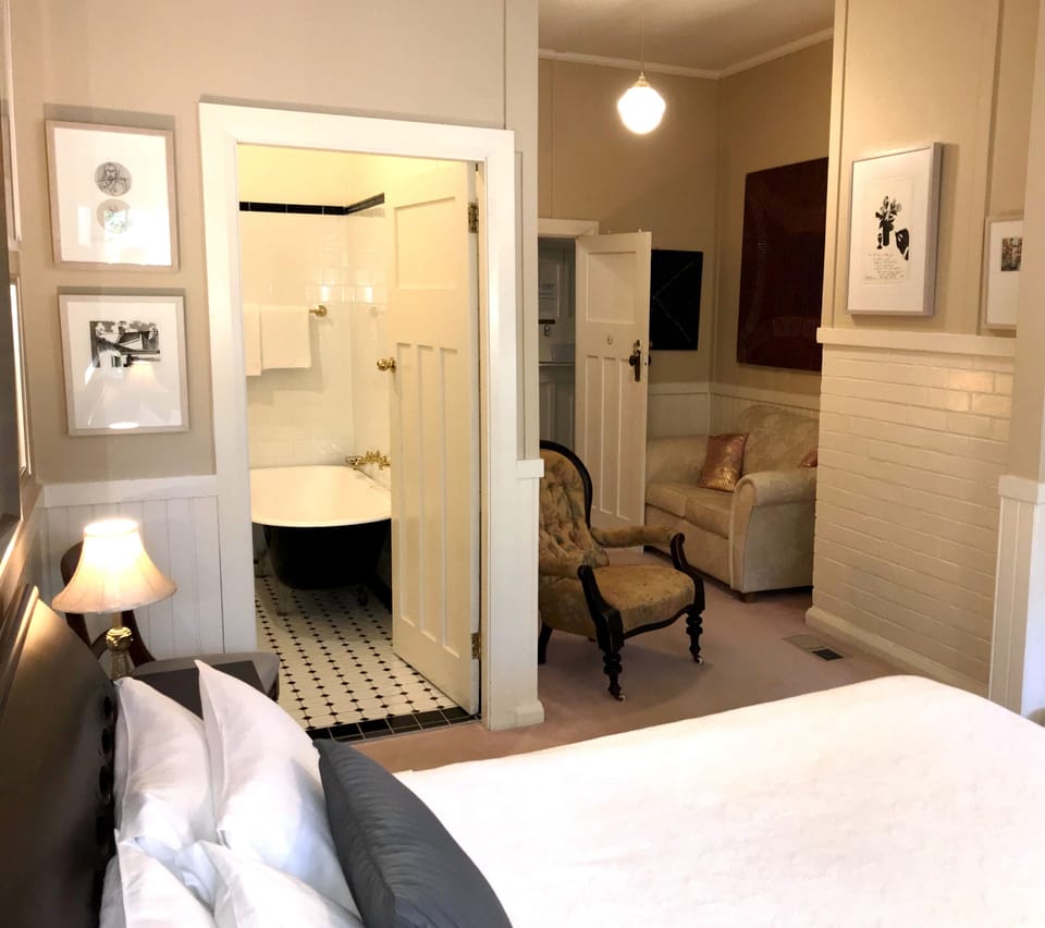 Standard Room, Non Smoking (3 - Queen Suite) | Iron/ironing board, WiFi (free), bed sheets