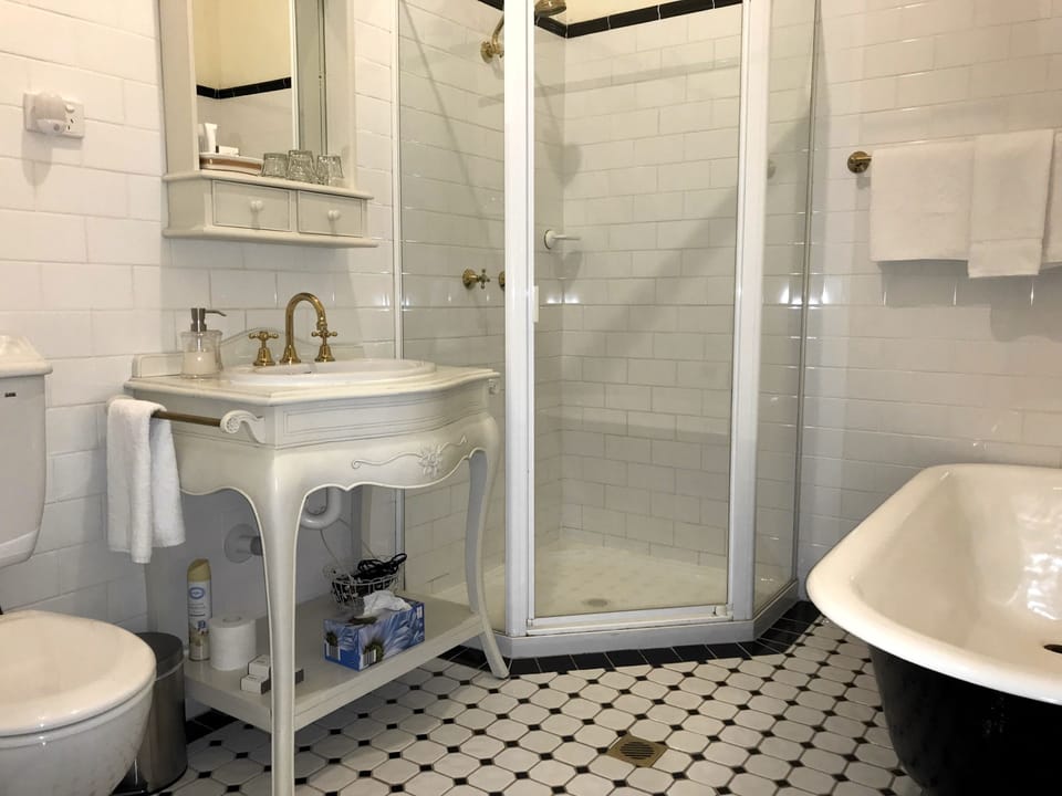 Standard Room, Non Smoking (3 - Queen Suite) | Bathroom | Free toiletries, hair dryer (on request), bathrobes, towels
