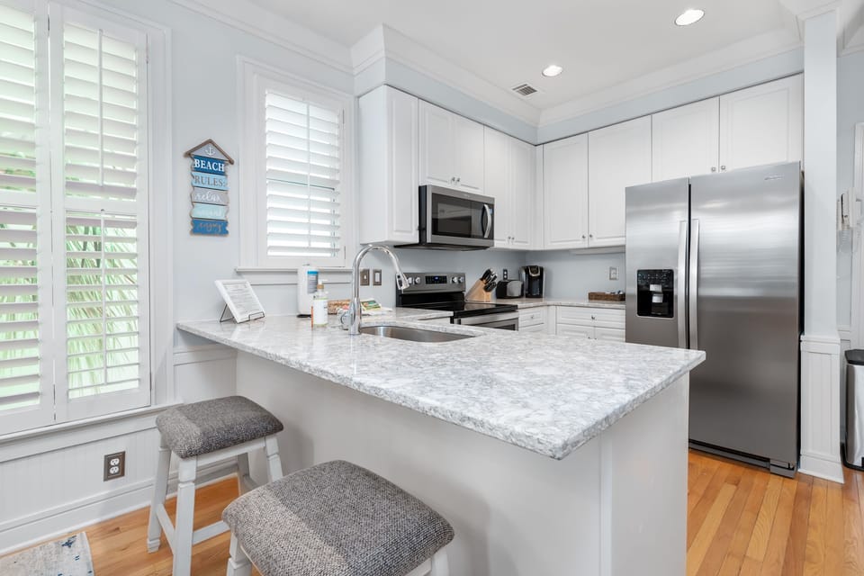 Updated kitchen with stainless appliances and quartz countertops
