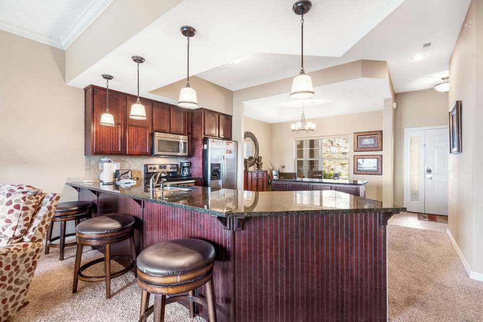 Fully Equipped Kitchen with Additional Bar Seating
