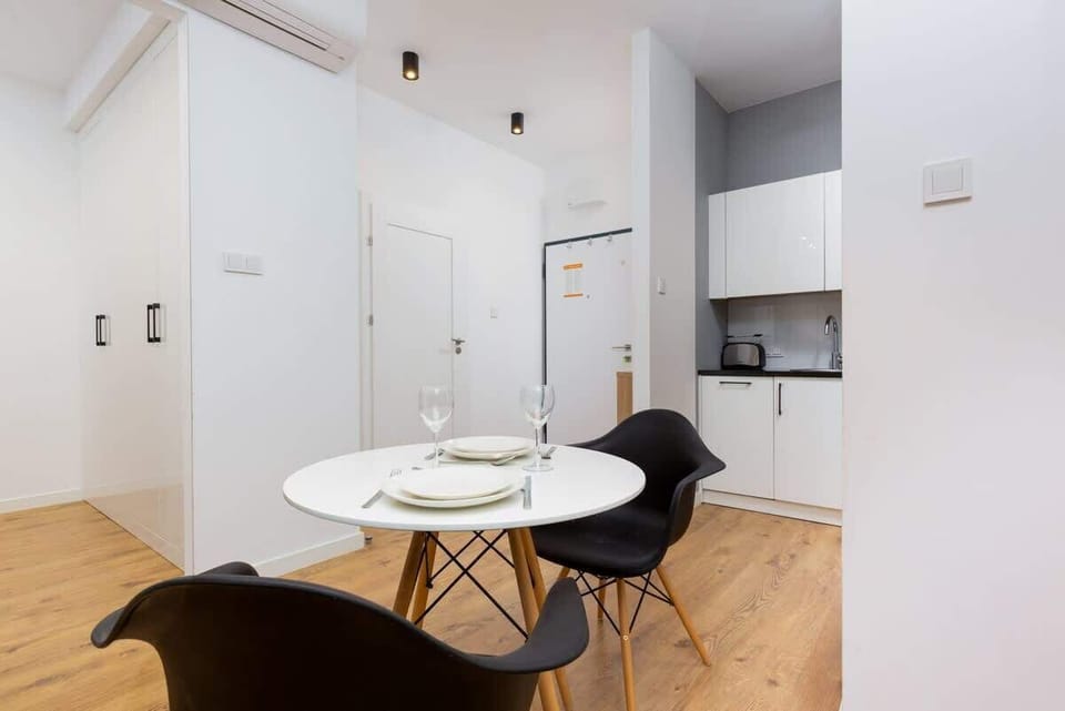 Large table with chairs for eating communal meals. 