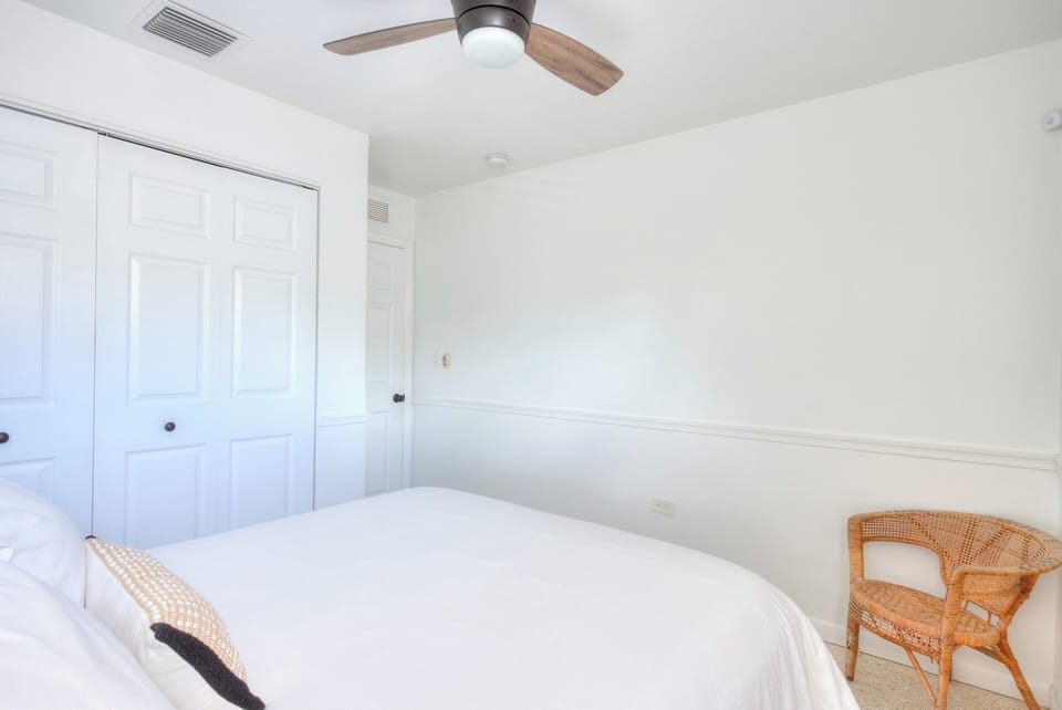 Coral bedroom with Queen size bed. 