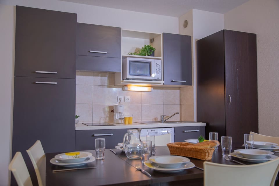 Prepare a meal in the equipped kitchen.