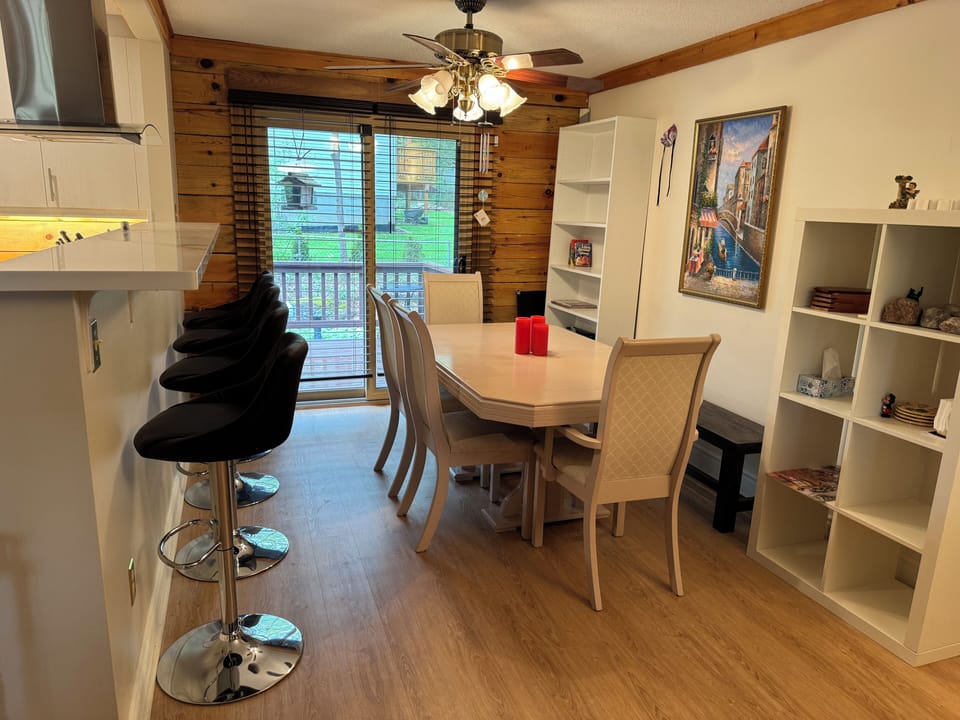 Dining table seats 8 plus 4 bar stools. Open kitchen concept.