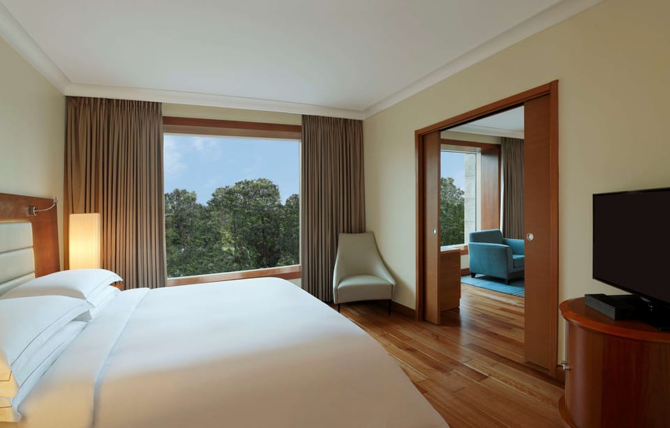 Club Suite, 1 King Bed, Kitchenette | Down comforters, minibar, in-room safe, individually decorated