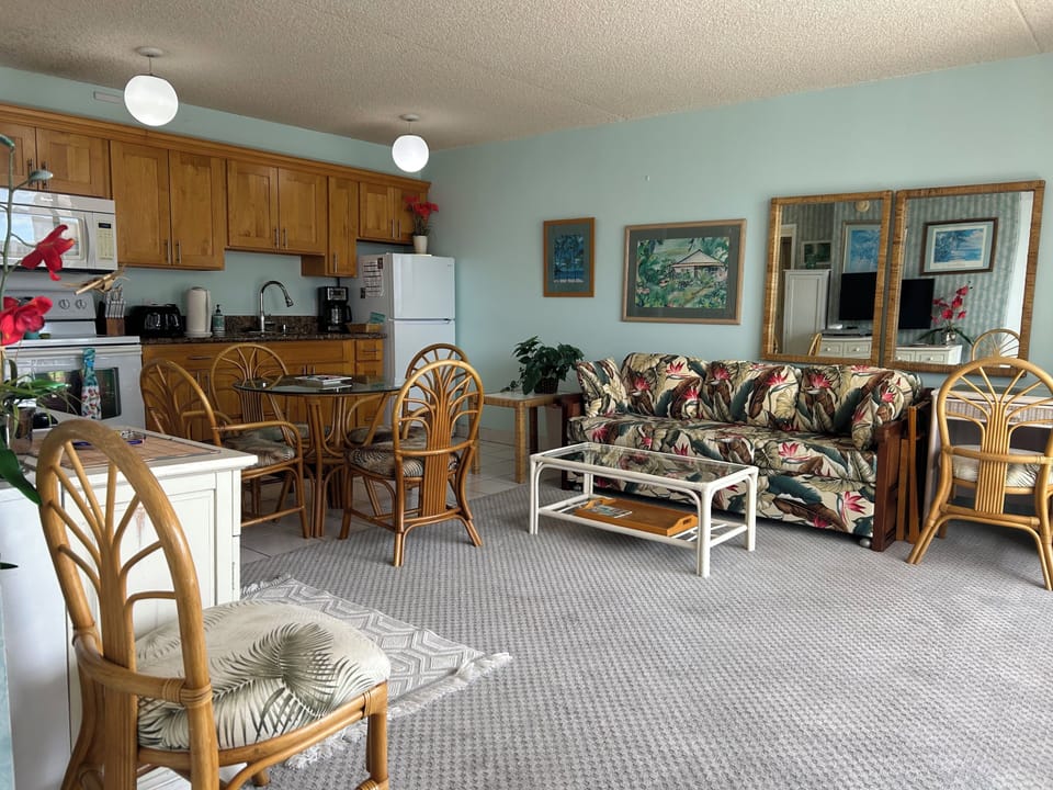 Living room  with Queen sofa sleeper, Flat Screen TV Just off the kitchen, with Mountain view to the Right and Ocean to the Left
