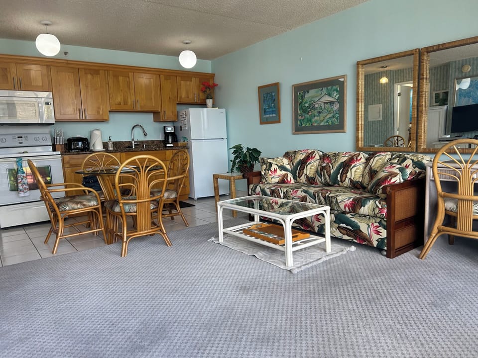 Living room  with Queen sofa sleeper, Flat Screen TV Just off the kitchen, with Mountain view to the Right and Ocean to the Left