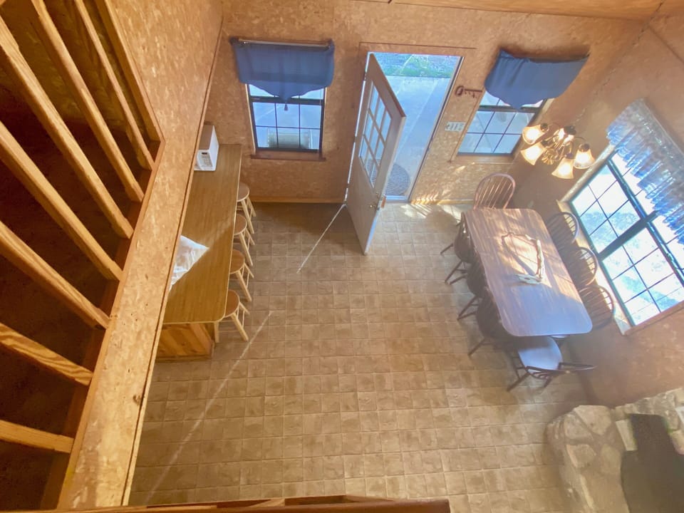 River Recess - Open cedar staircase leads to the second floor loft.