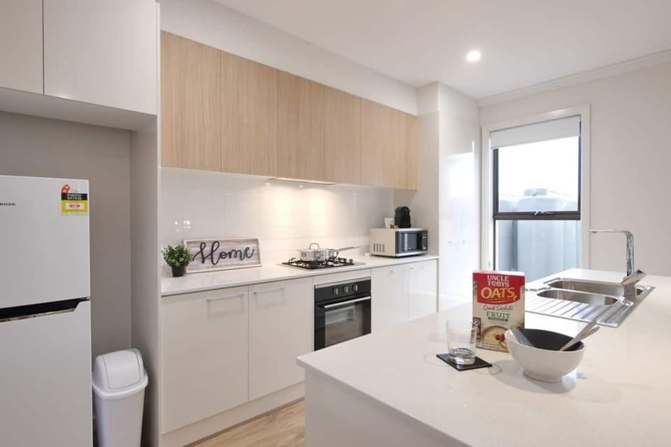 Modern kitchen space fully equipped with everything you need to make a home cooked meal.