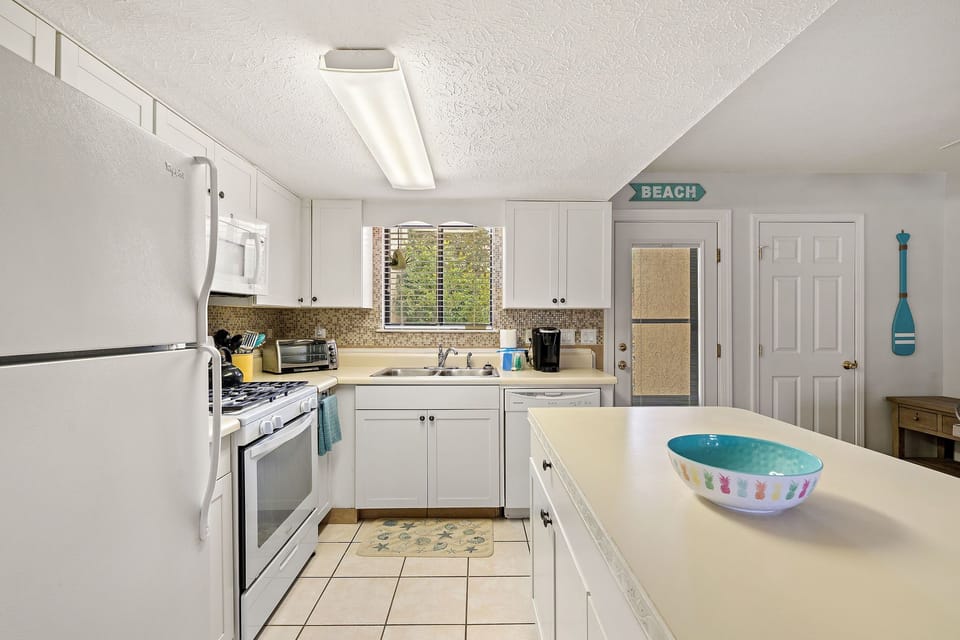 Kitchen - A kureg, a Mr. Coffee, a toaster oven, blender, mixer, crock pot...