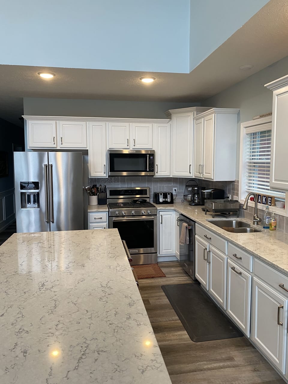 Stainless Steel, Island has built in warming drawer, icemaker, refrigerator draw