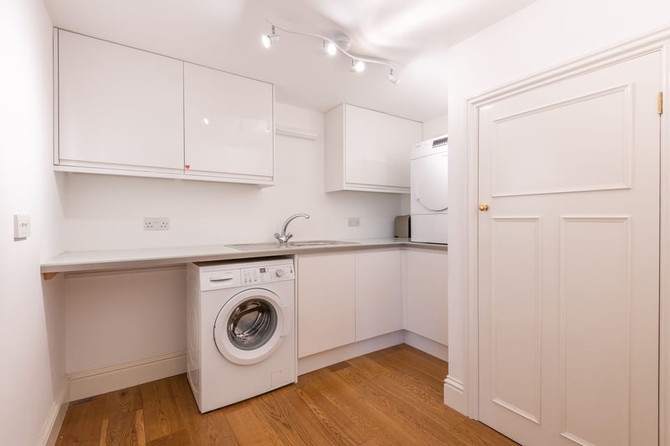 Utility room with washing machine and dryer
