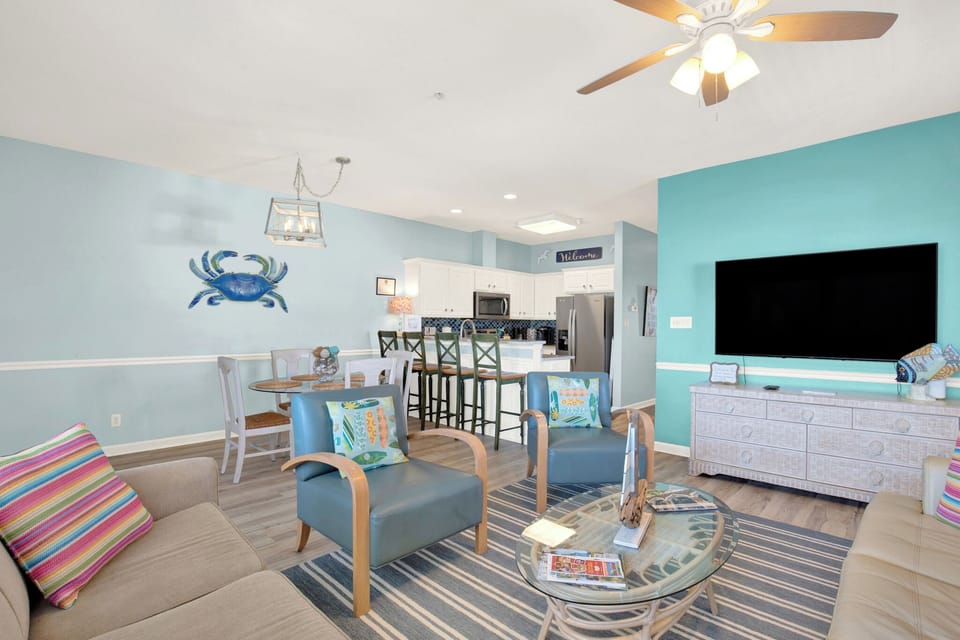 Open living room, dining, and kitchen
