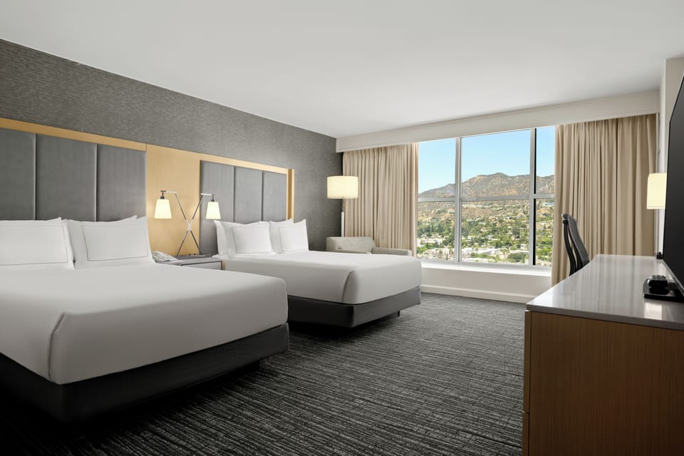 Premium bedding, down comforters, pillowtop beds, in-room safe