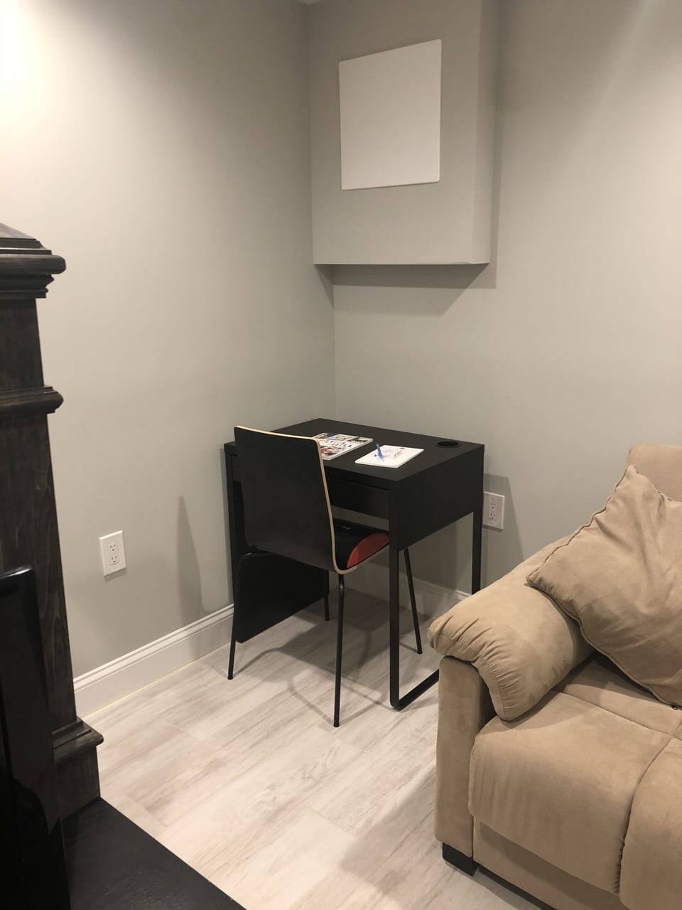 Part of the living room with your own personal desk to get work done 