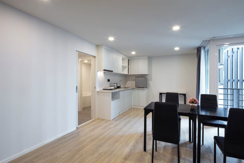 Family Two Bed Room Suite | Living area | 32-inch LED TV with digital channels, TV