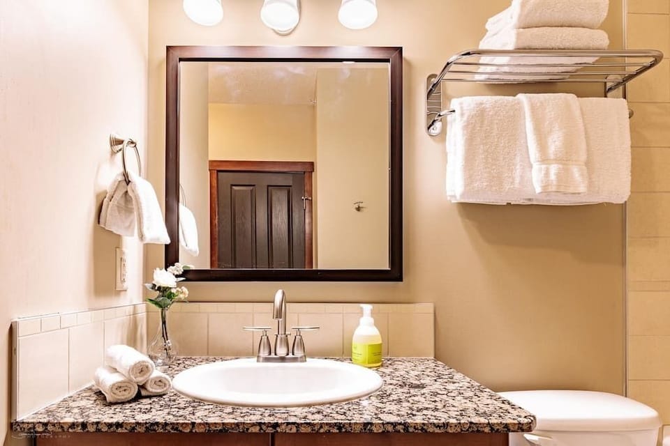 The bathroom comes stocked with complimentary local Rocky Mountain Soap Company shampoo, conditioner, body wash and bubble bath. Relax in the soaker tub, or enjoy the separate walk-in shower.