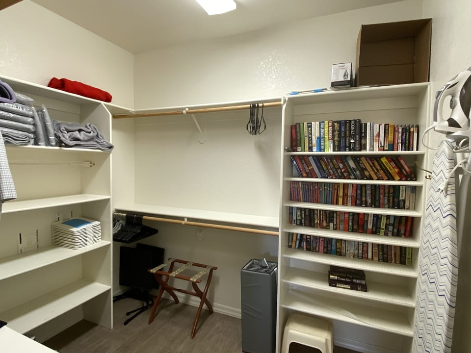 Main Closet with Paperback library for your use during stay