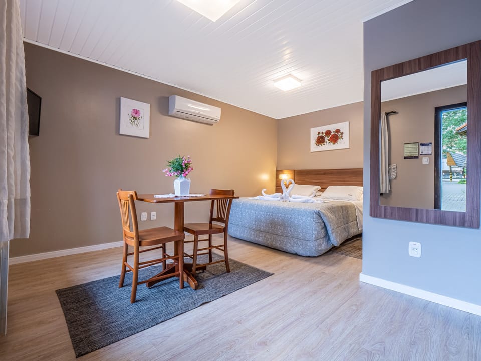 Economy Chalet, 1 Bedroom, Garden Area | Minibar, in-room safe, desk, blackout drapes