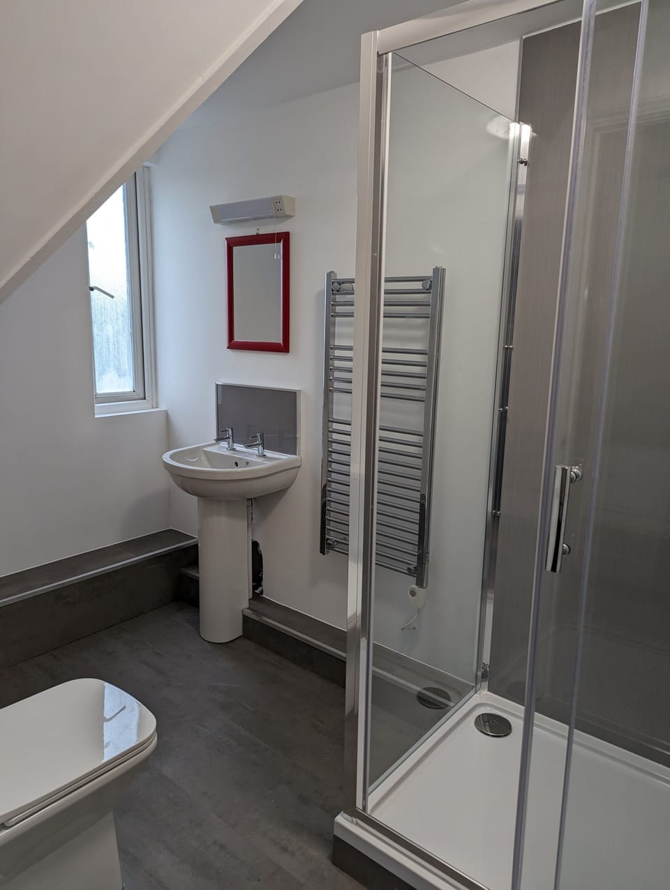 Shower, hair dryer, towels, toilet paper