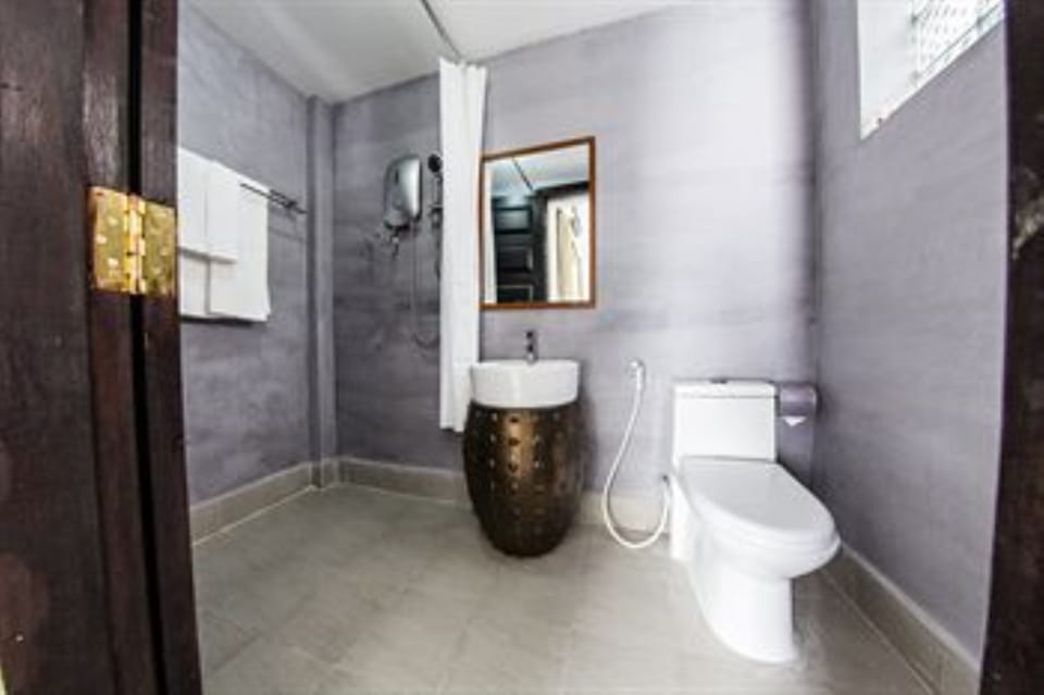 Shower, designer toiletries, hair dryer, slippers