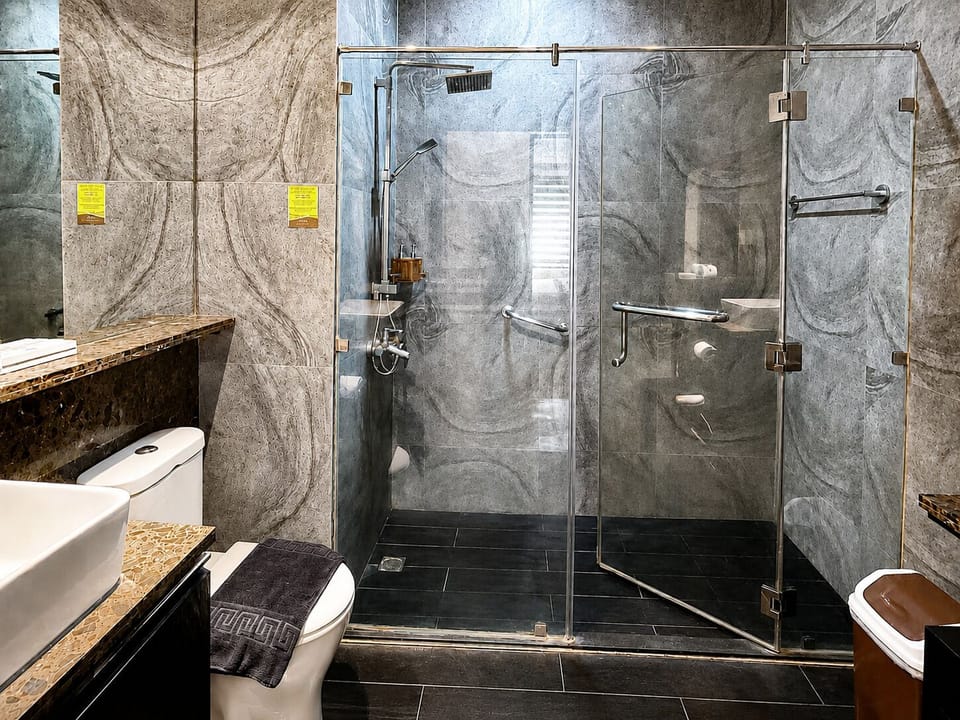Two Bedroom Suite | Bathroom | Shower, rainfall showerhead, free toiletries, slippers