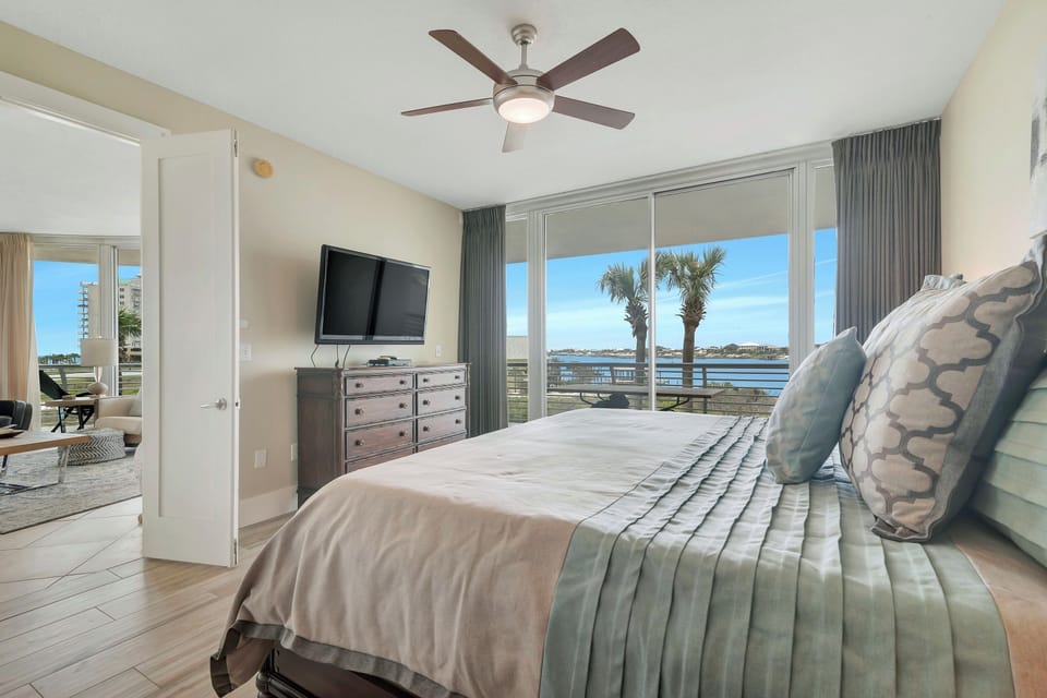 Primary Bedroom - Enjoy a restful night's sleep with panoramic coastal views from this beautifully designed bedroom. The seamless transition to the balcony allows you to fully immerse yourself in the beauty of Ole River.