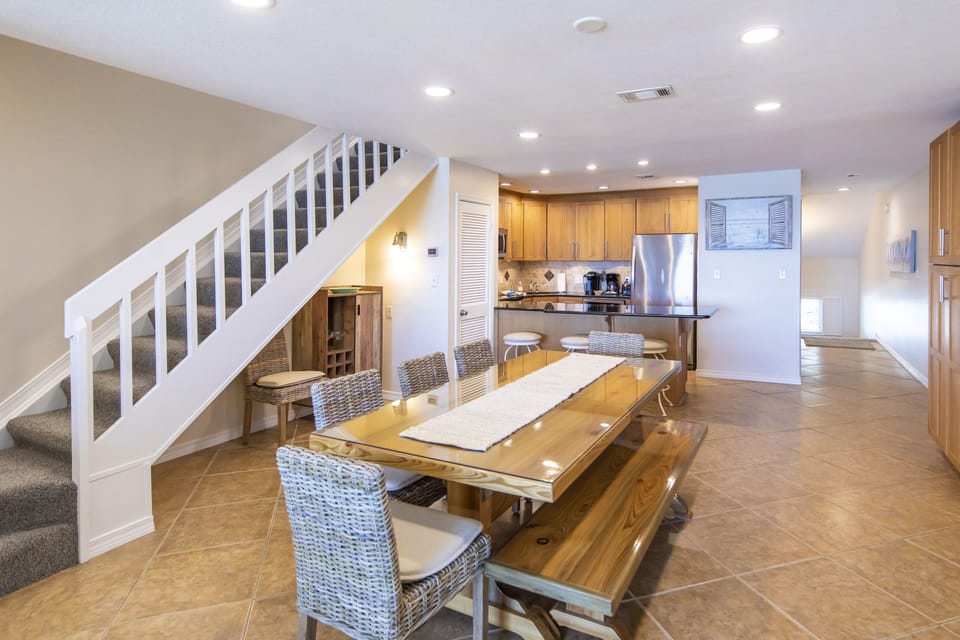 Spacious dining area with stairs up to the bedrooms.
