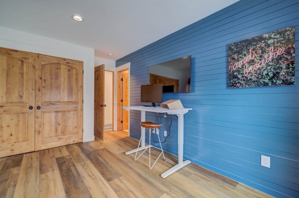 1st Floor - Office/Murphy Bed - Sit/Stand Desk w/ Monitor, 60" Samsung Smart TV w/ free streaming.