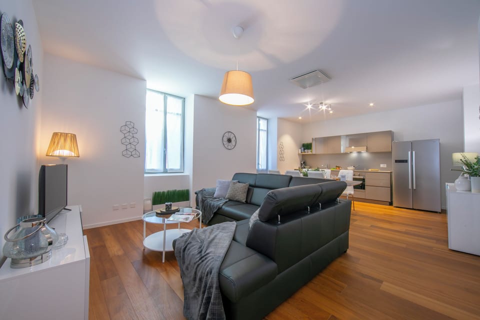 Family Apartment, 2 Bedrooms, 2 Bathrooms (Star of Lugano) | Living area | 21-inch TV with satellite channels