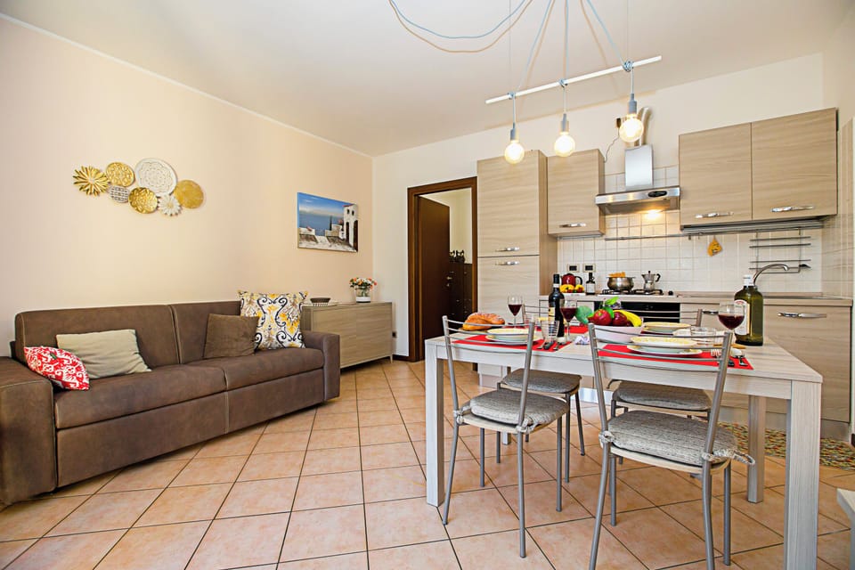 Family Apartment, Multiple Bedrooms (Borgo Degli Ulivi shared pool- 200m) | Living area | TV