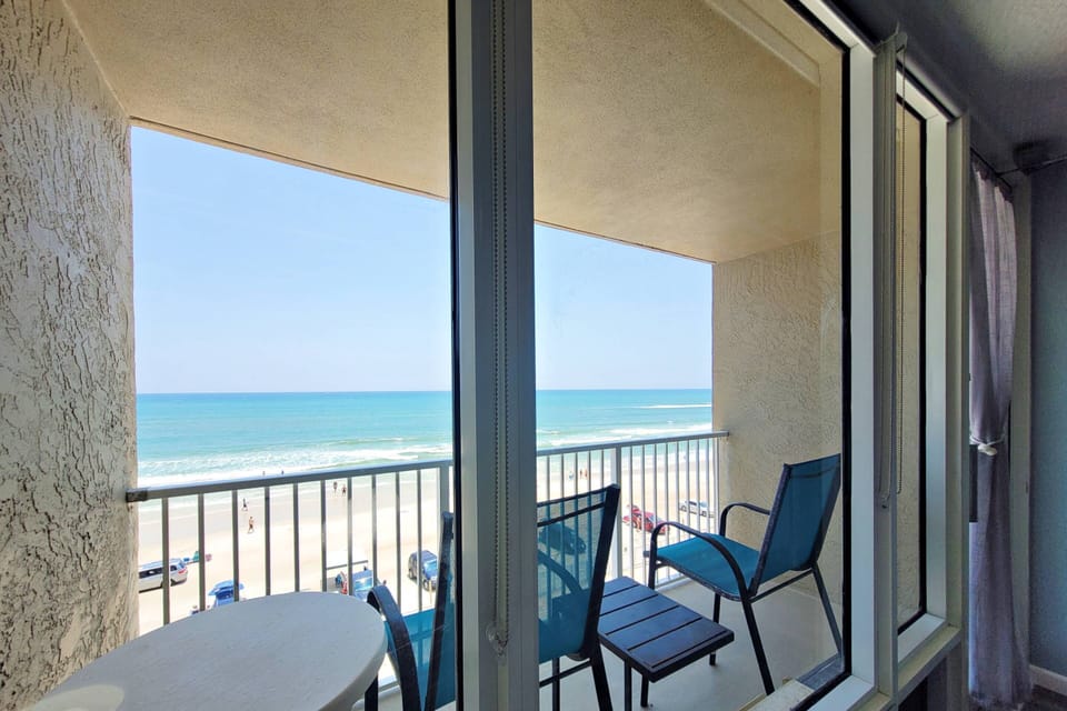 Private balcony with  2 chairs and tables.