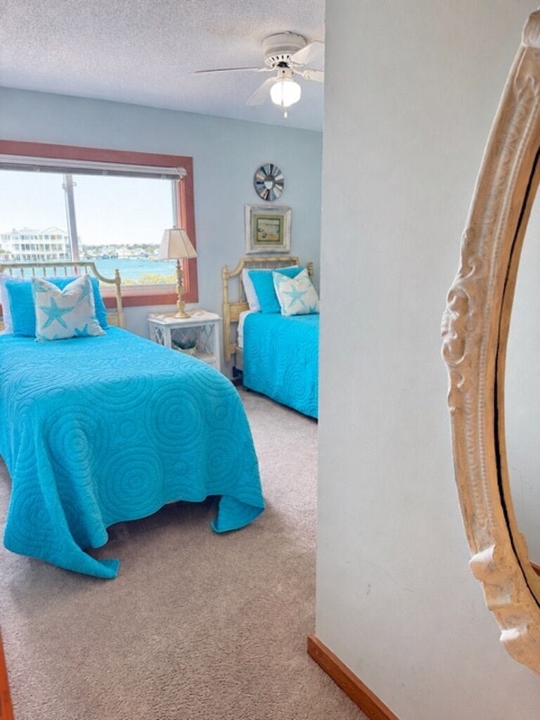Sound side bedroom with two xlong twin beds.