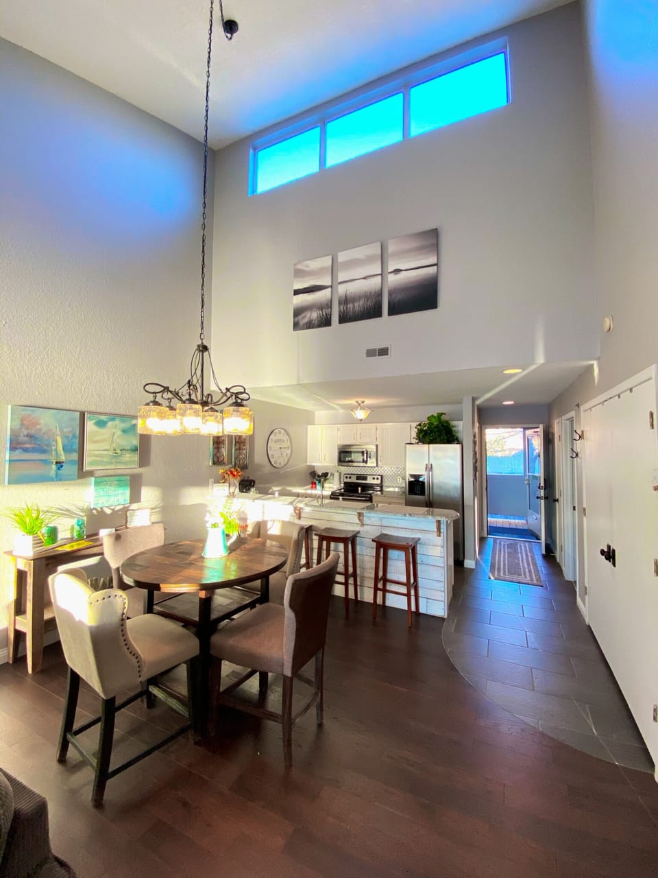 Walk into vaulted ceilings, open kitchen, living, and dining and skylight