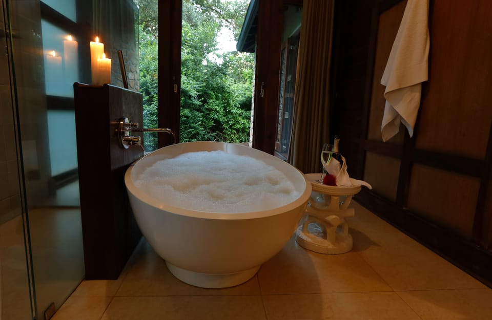 Luxury Room, 1 Queen Bed, Balcony | Bathroom | Separate tub and shower, deep soaking tub, rainfall showerhead