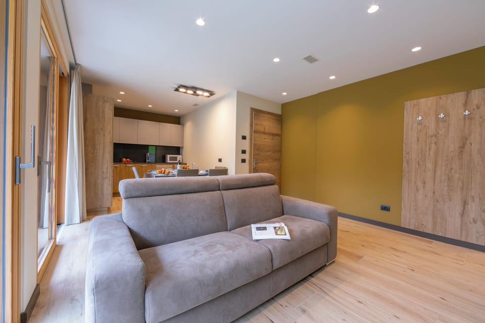 Family Apartment, 2 Bedrooms, Microwave (Casa Giardino Ski in - Ski out 100m) | Living area | TV, fireplace