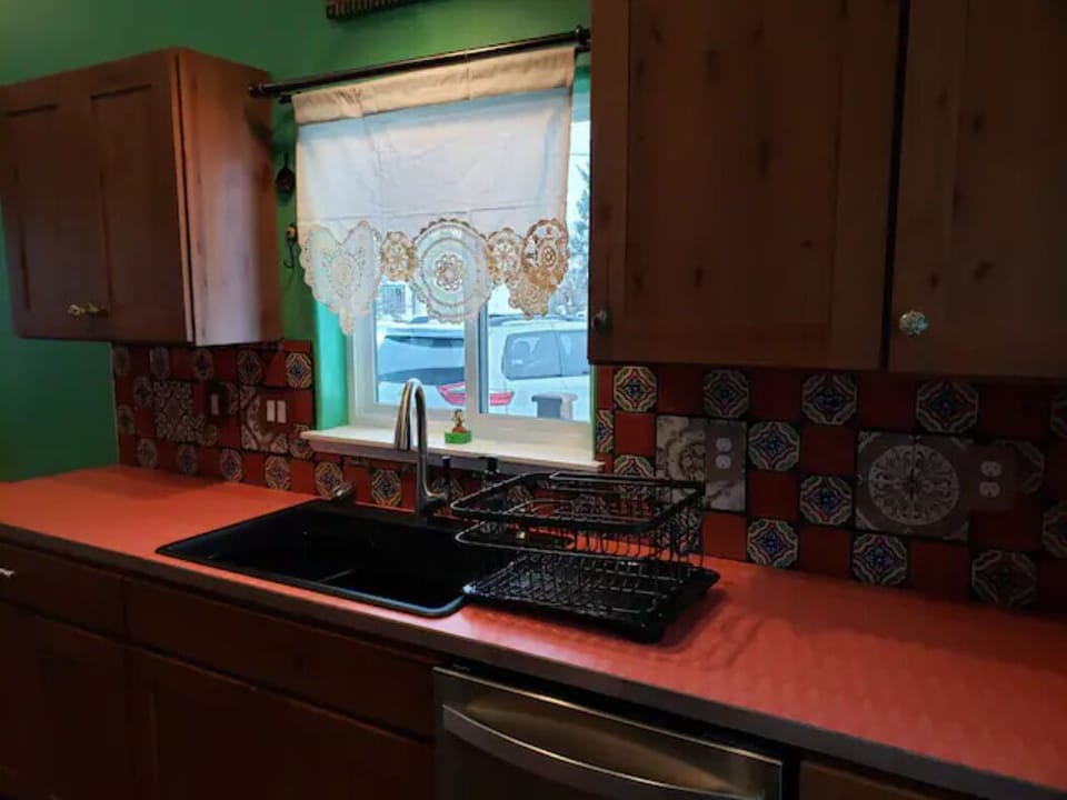 Kitchen area w/ dishwasher