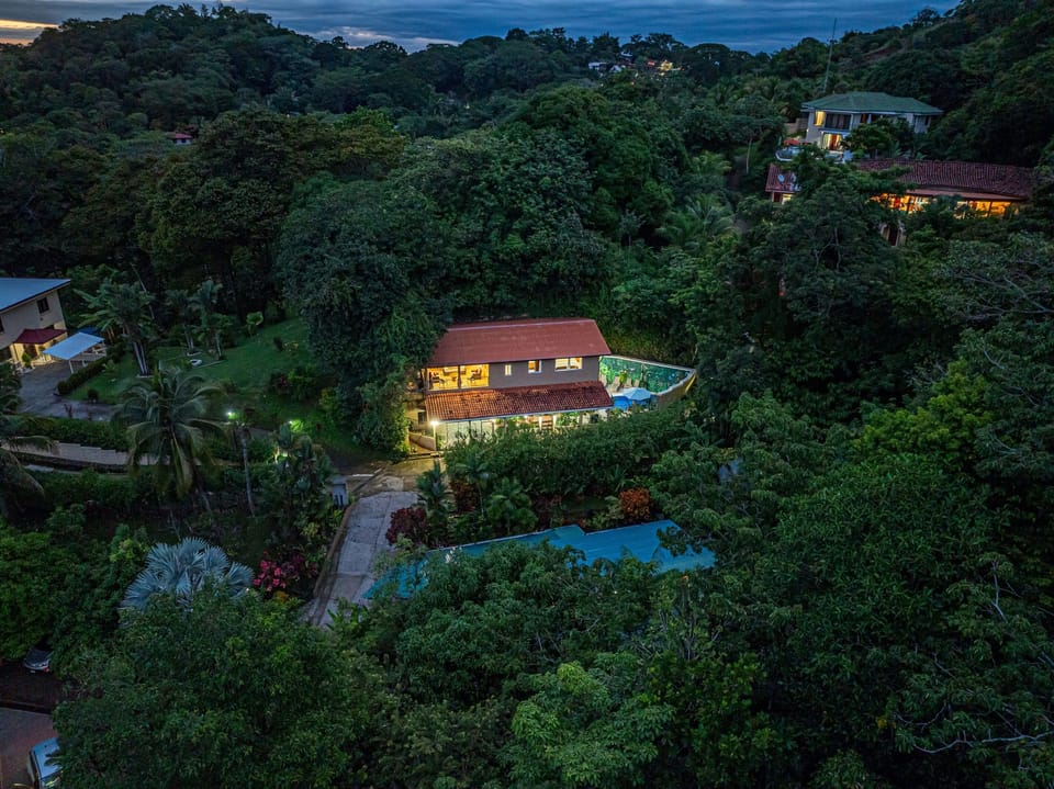 Private villa glowing beautifully within the jungle at night