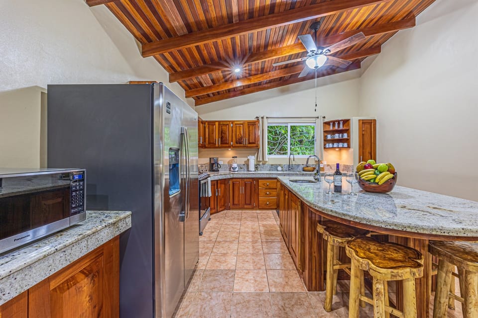 Spacious kitchen with island seating — ideal for cooking and gathering