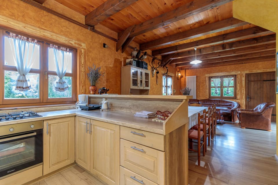 Family House, 4 Bedrooms, 2 Bathrooms, Mountainside (Chalet Zavrh with Private Heated Pool) | Private kitchen | Full-size fridge, stovetop, dining tables
