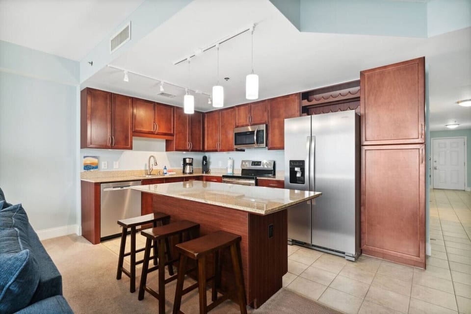 Fully Stocked Kitchen with bar and seating for 3