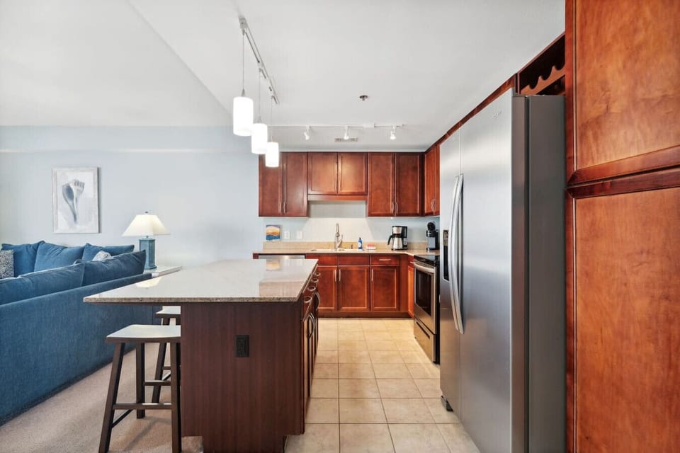 Fully Stocked Kitchen with bar and seating for 3