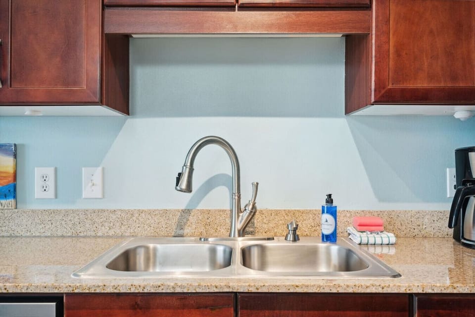 Fully Stocked Kitchen with bar and seating for 3