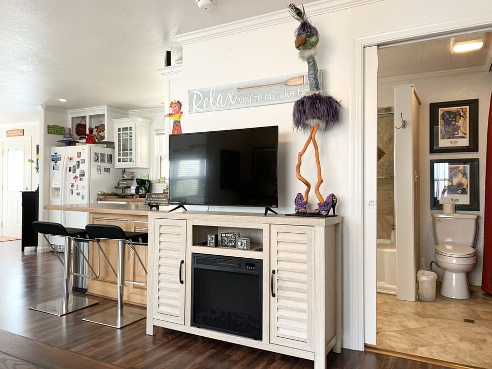 Living Room with Smart Television and Electric Fireplace