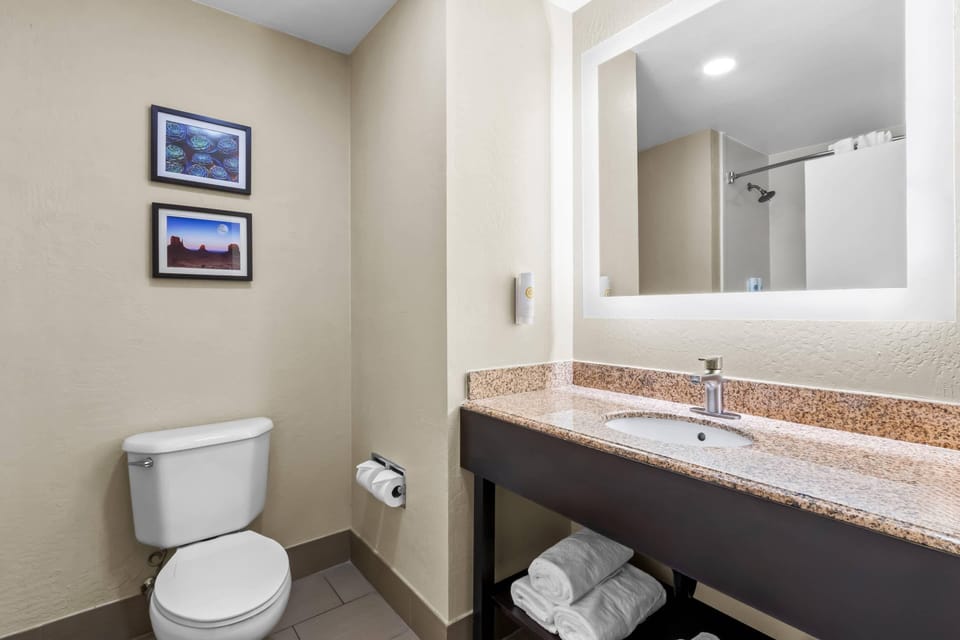 Superior Suite, Bed Room with King Bed, Living Room, Non-Smoking | Premium bedding, laptop workspace, blackout drapes, iron/ironing board